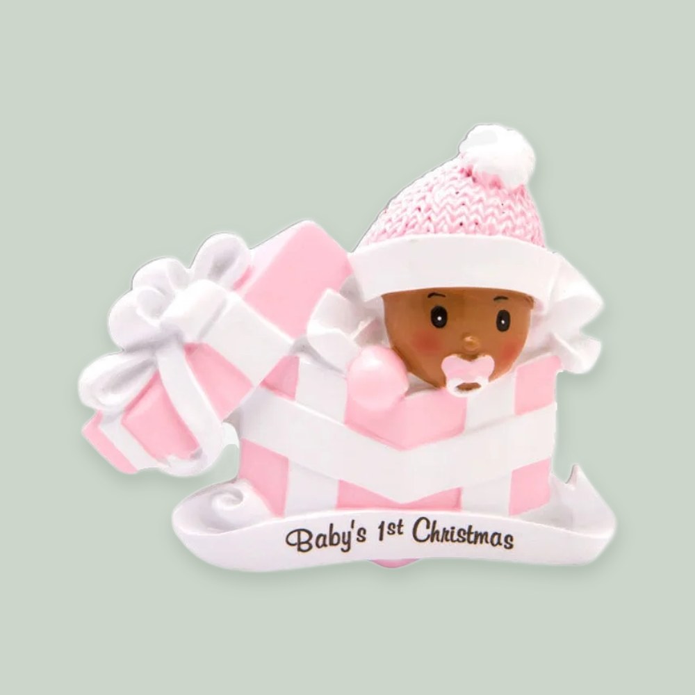 Baby Girl in Present — Dark Skin Tone ornament on a sage green background