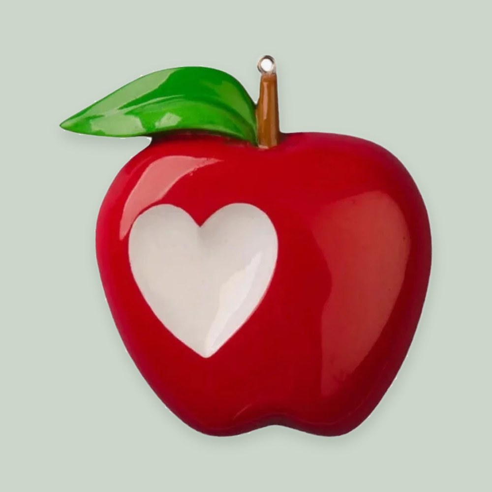 Teacher Apple ornament on a sage green background