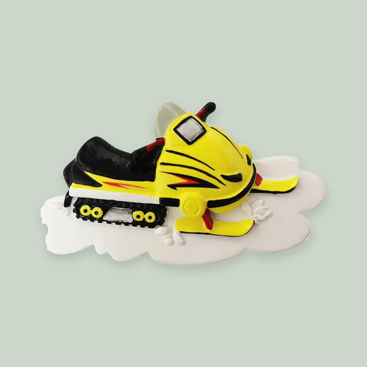 Yellow Snowmobile ornament on a sage green background