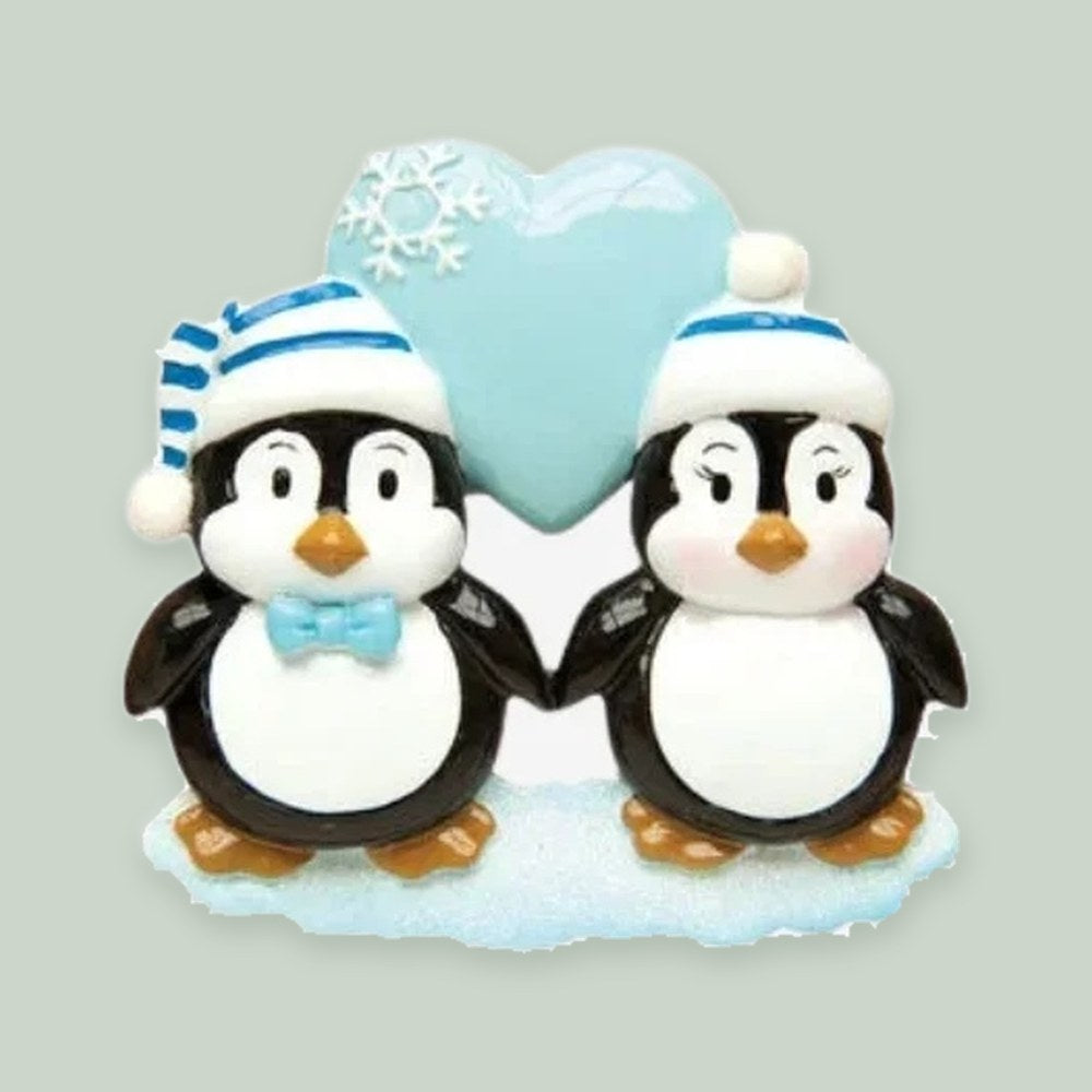 Penguin Couple with Blue Heart ornament on a sage green background