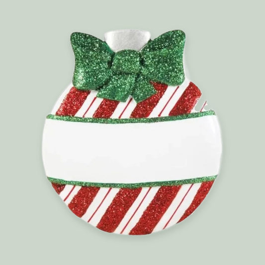 Striped Christmas Bauble with Green Bow ornament on a sage green background