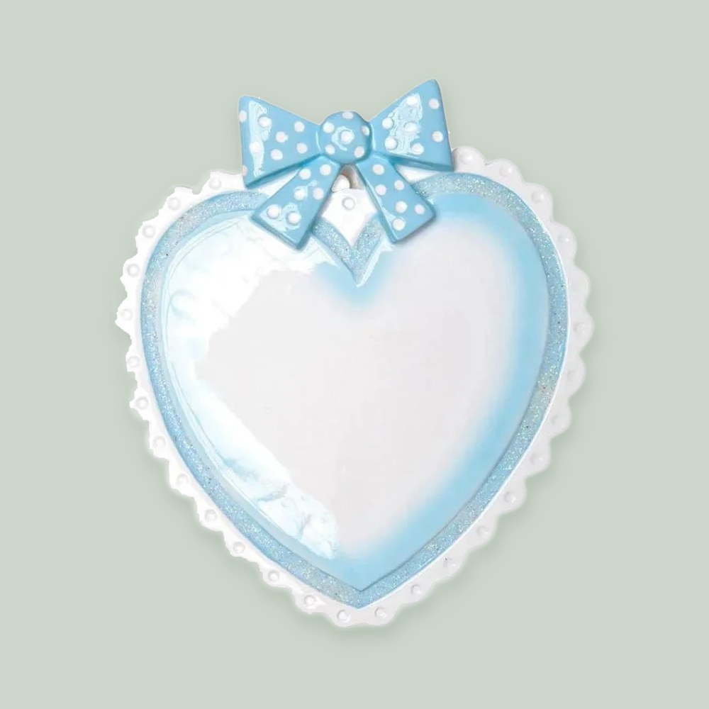 Lt. Blue Baby Heart ornament on a sage green background
