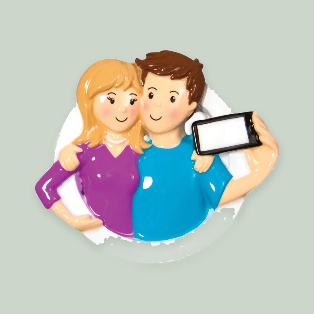 Selfie Couple ornament on a sage green background