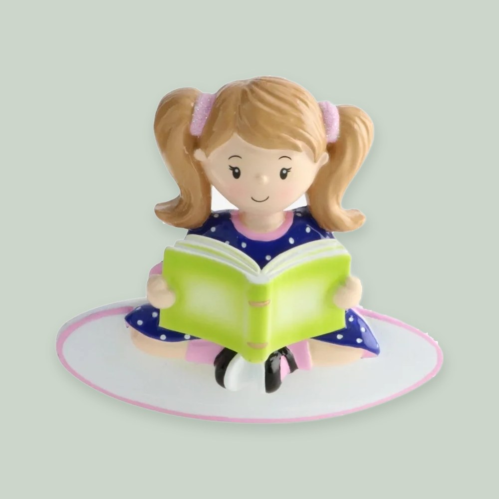 Girl Reading a Book ornament on a sage green background