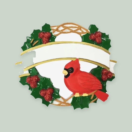 Cardinal Christmas Wreath ornament on a sage green background