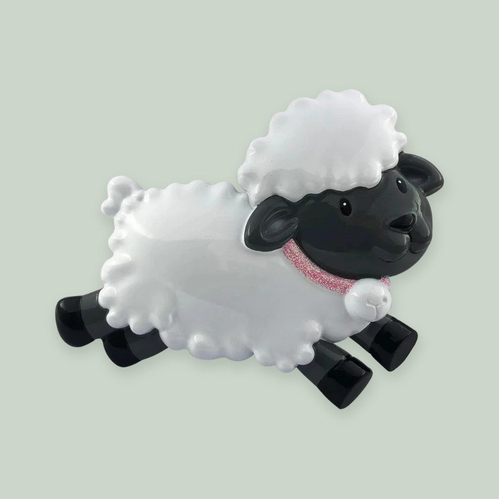 Baby’s First Sheep (Pink) ornament on a sage green background