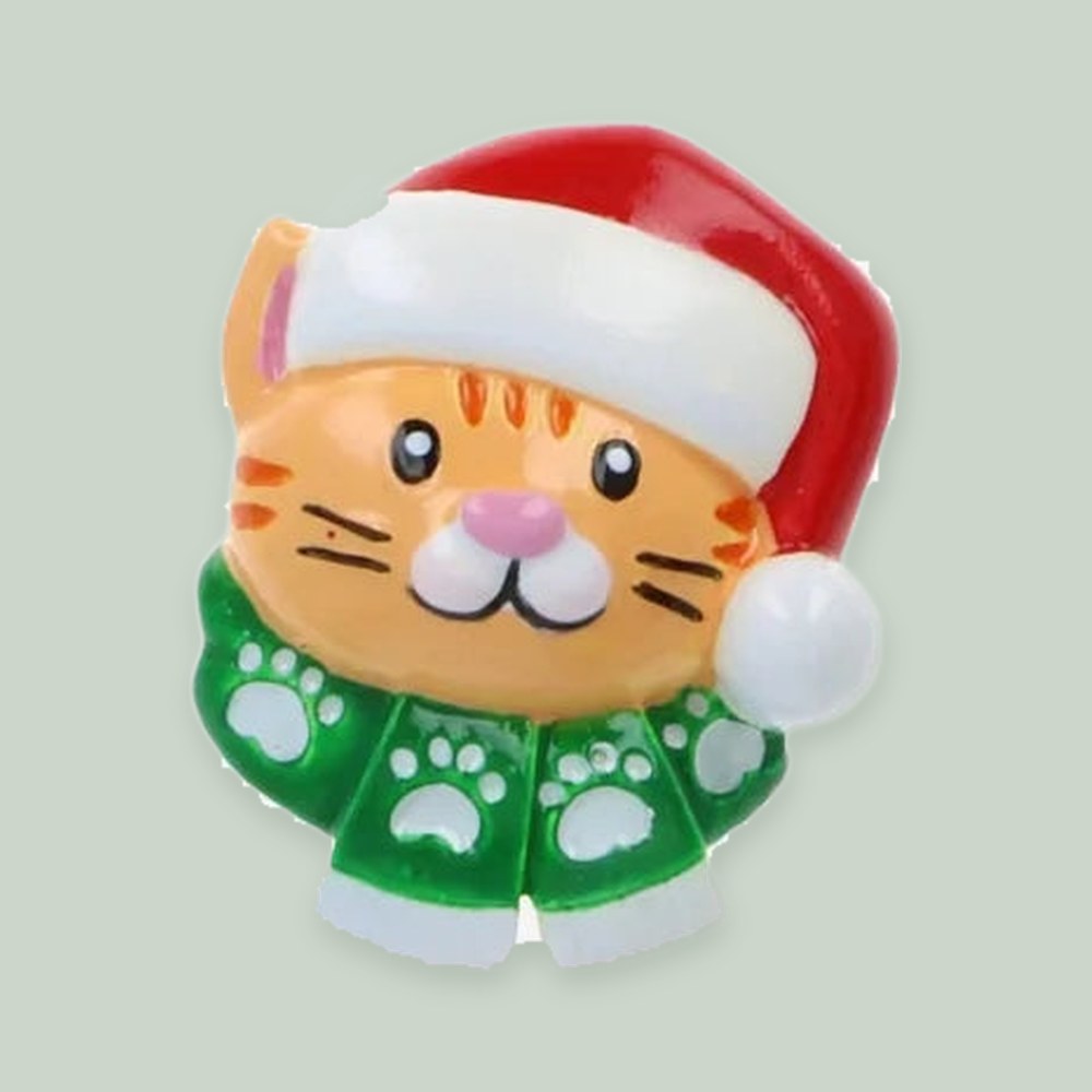 Santa Hat Cat Head Add-On — Orange Tabby — one piece on a sage background