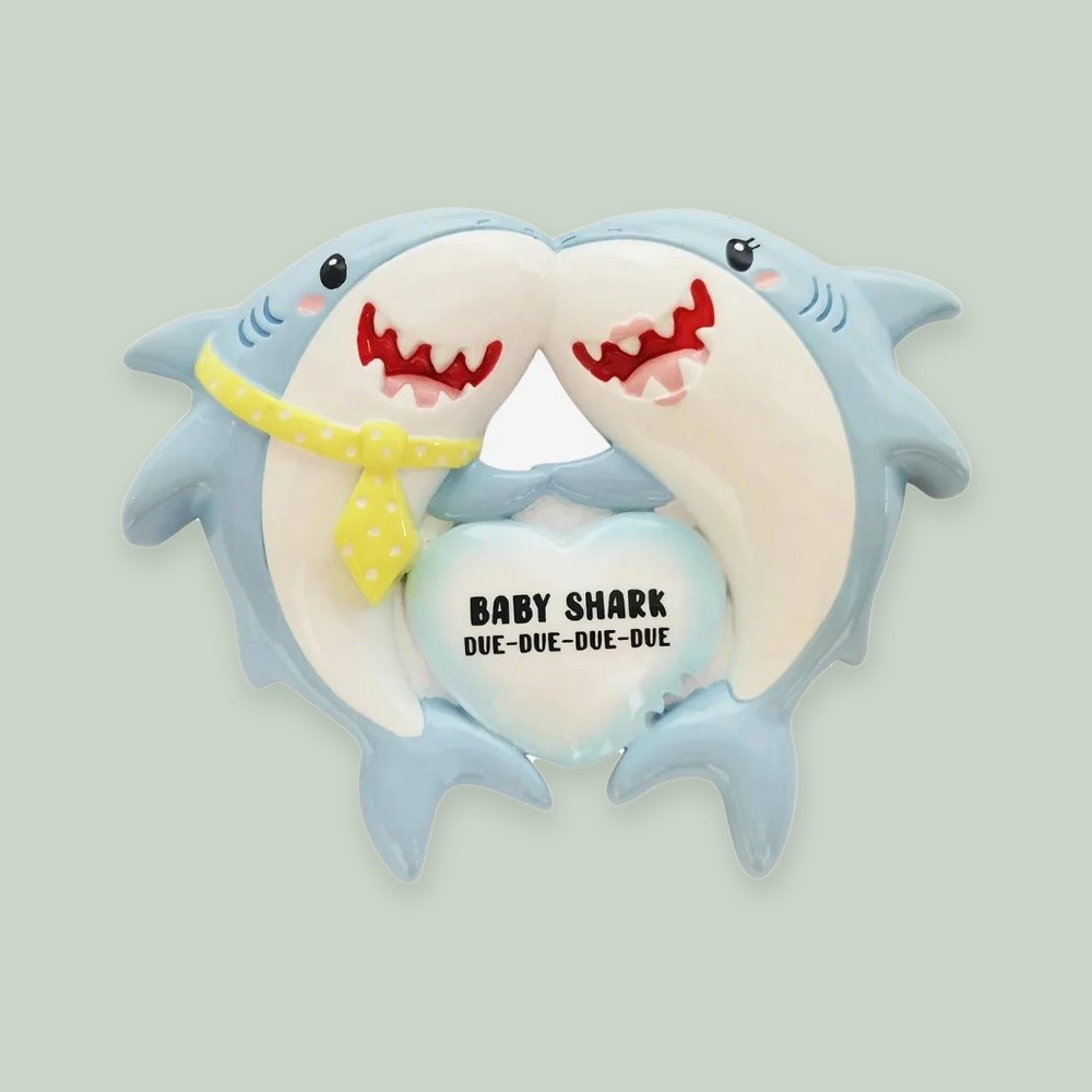We're Expecting Shark Family ornament on a sage green background