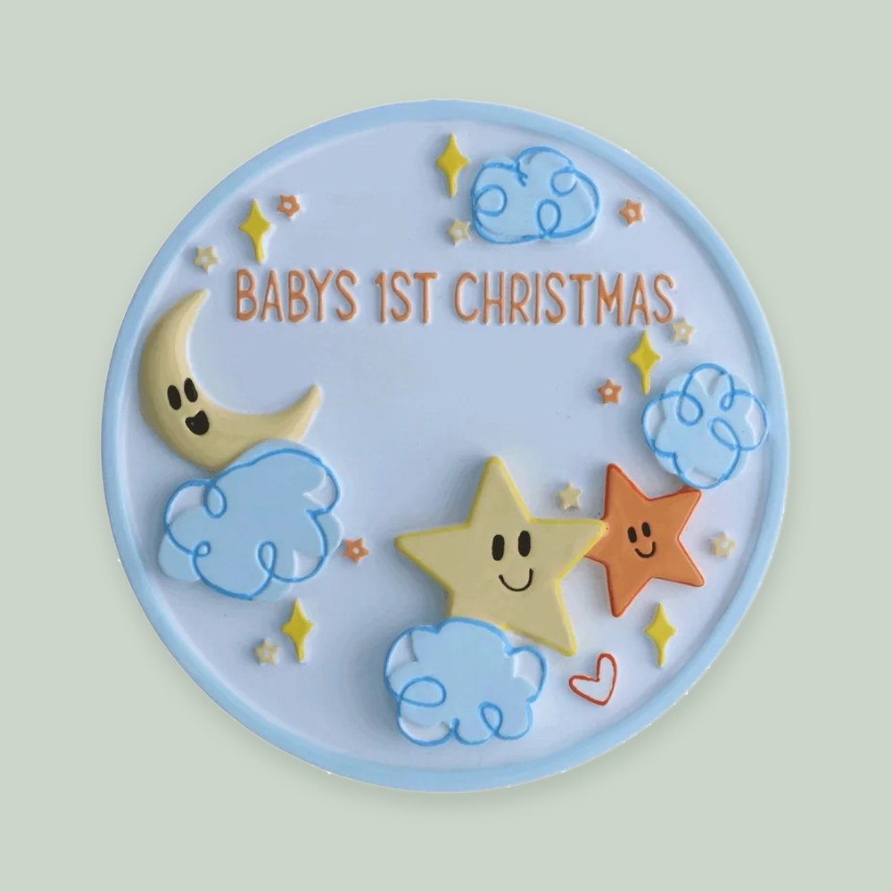 Baby’s 1st Christmas Stars and Clouds ornament on a sage green background