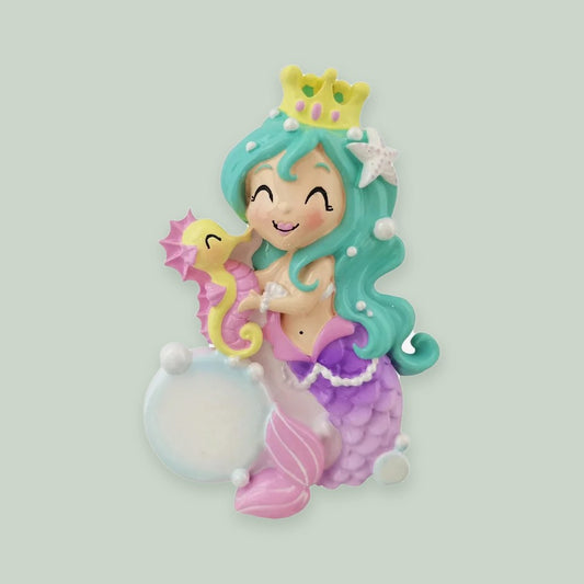 Mermaid ornament on a sage green background
