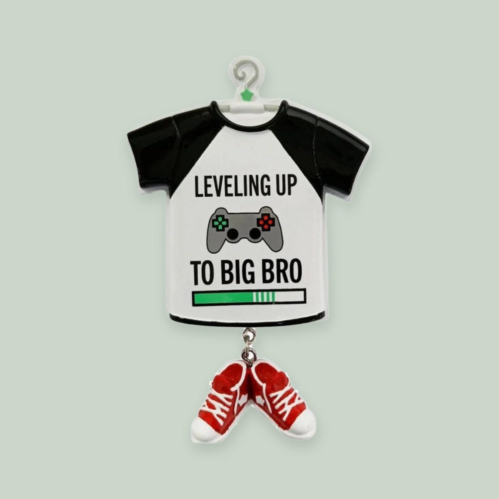“Leveling up to Big Bro” Big Brother ornament on a sage green background