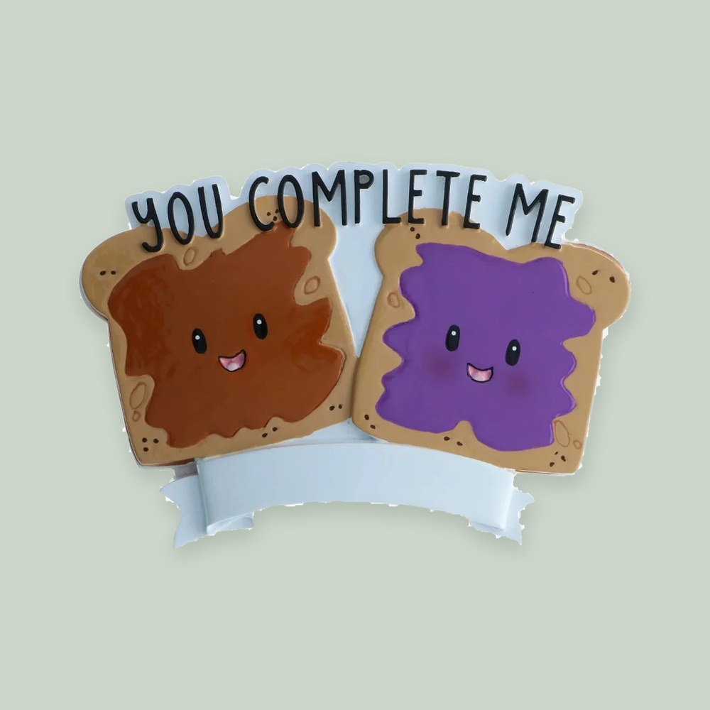 You Complete Me Peanut Butter and Jelly ornament on a sage green background