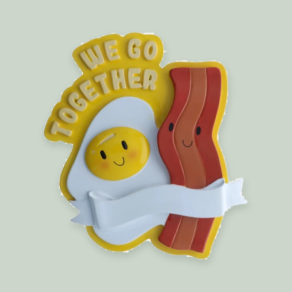 Bacon and Eggs Couple ornament on a sage green background