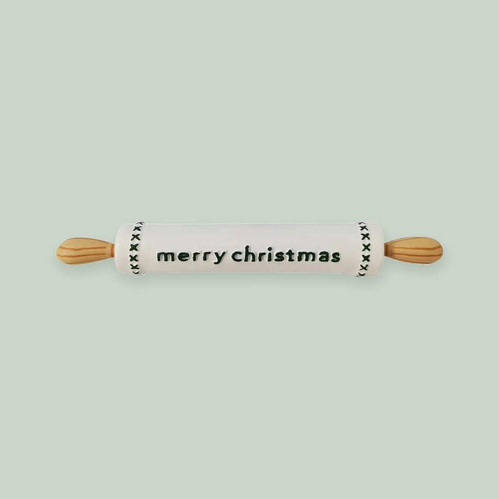 Rolling Pin ornament on a sage green background