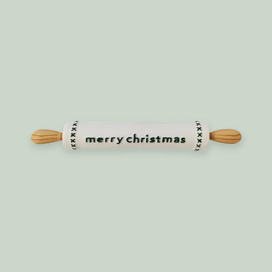 Rolling Pin ornament on a sage green background