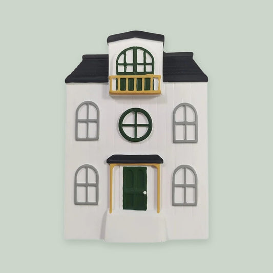 3D Doll House ornament on a sage green background