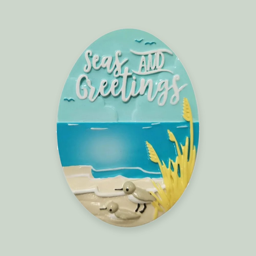 Seas and Greetings ornament on a sage green background