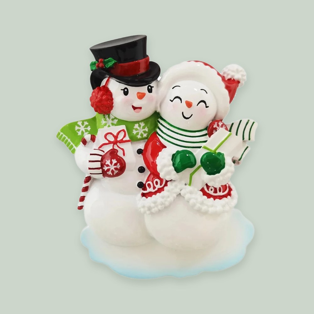 Snowmen Couple ornament on a sage green background