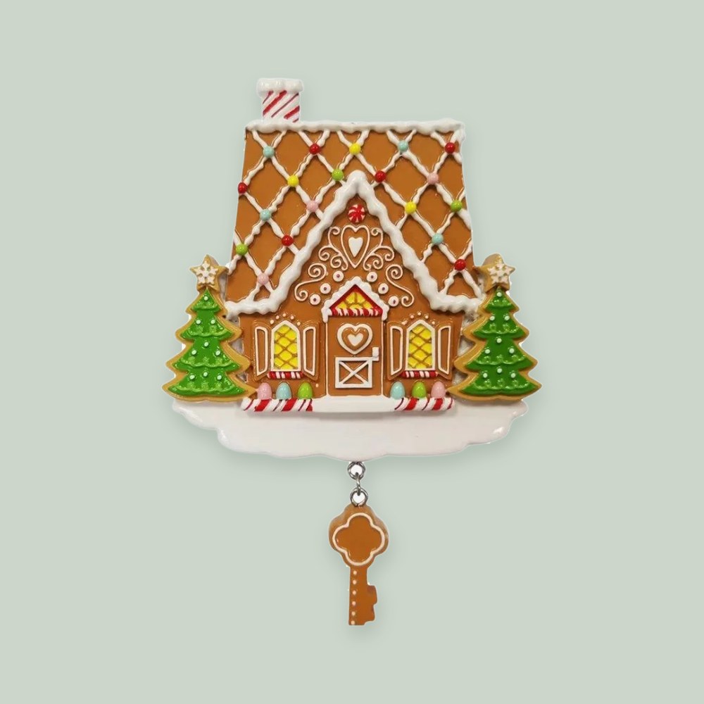 Gingerbread Our First Home ornament on a sage green background