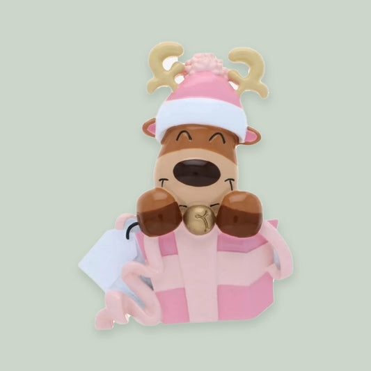 Baby Reindeer in Gift Box (Pink) ornament on a sage green background