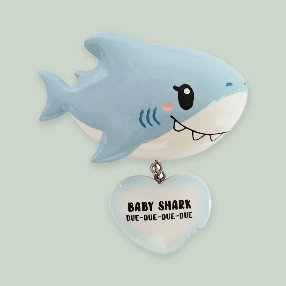 Baby Shark (Blue) ornament on a sage green background