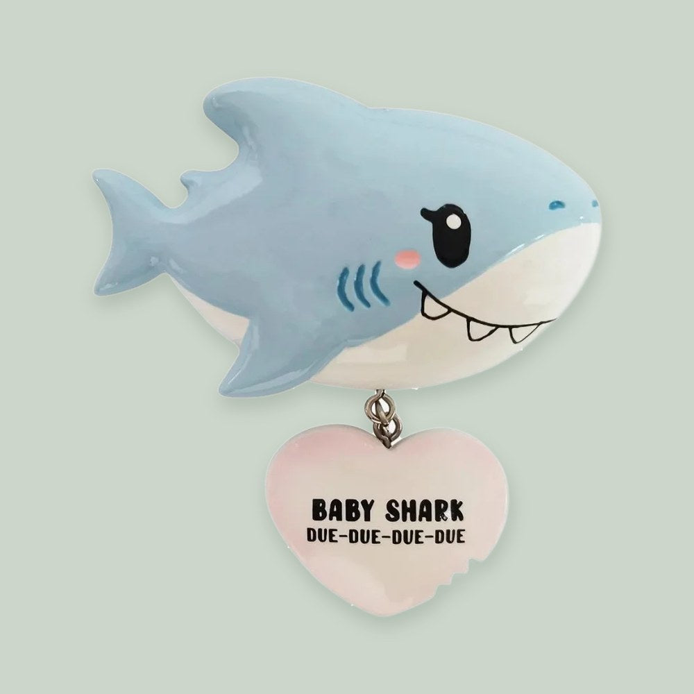 Baby Shark (Pink) ornament on a sage green background