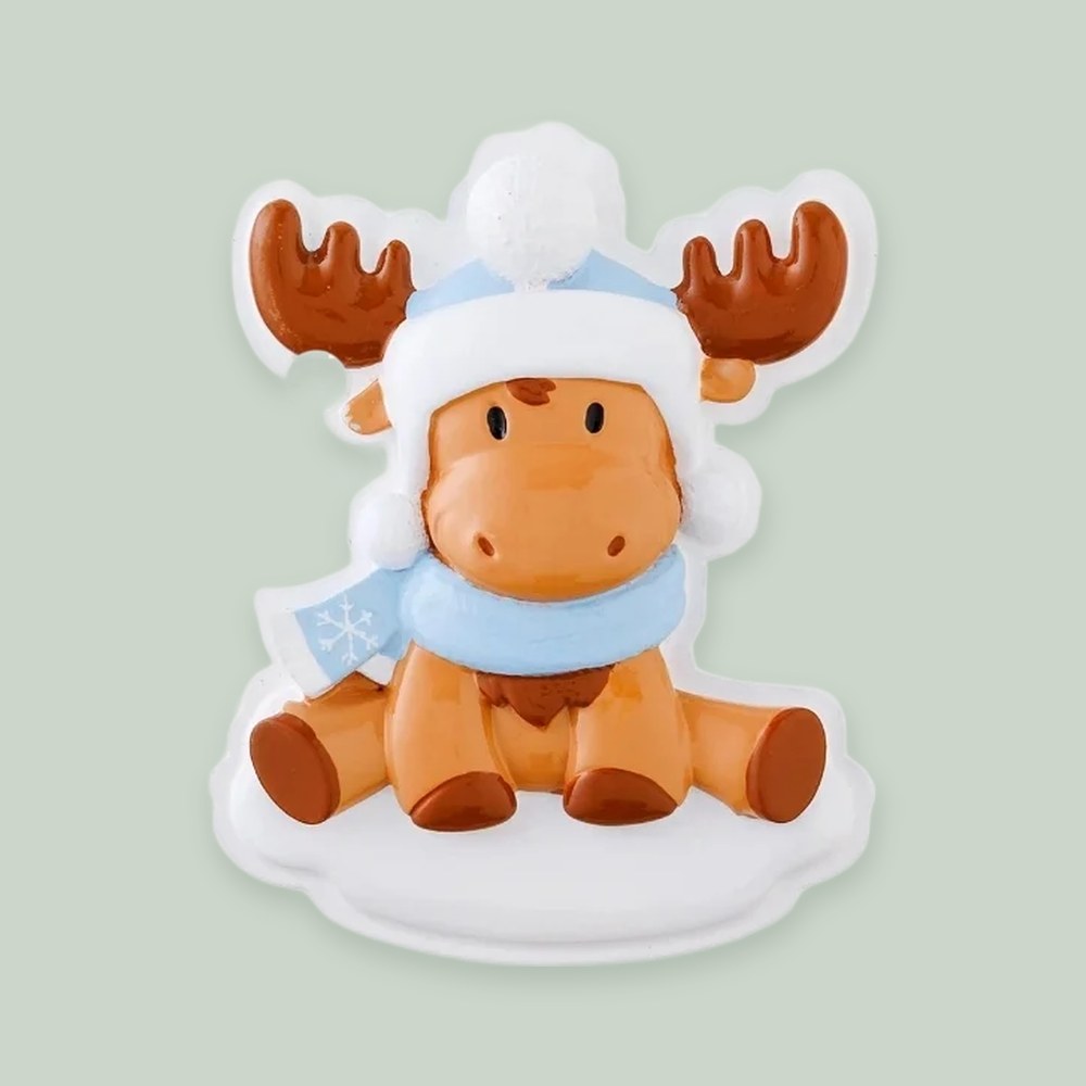 Moose Baby (Blue) ornament on a sage green background