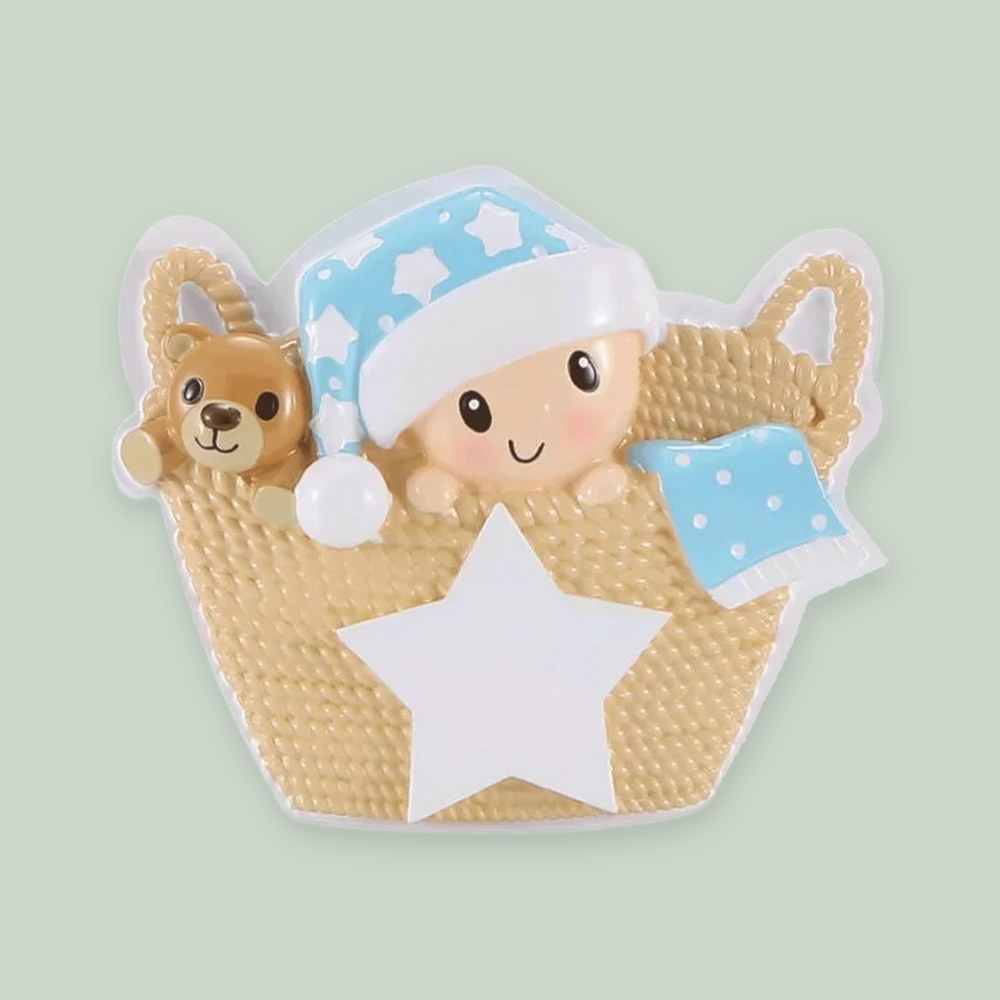 Baby in Basket (Blue) ornament on a sage green background