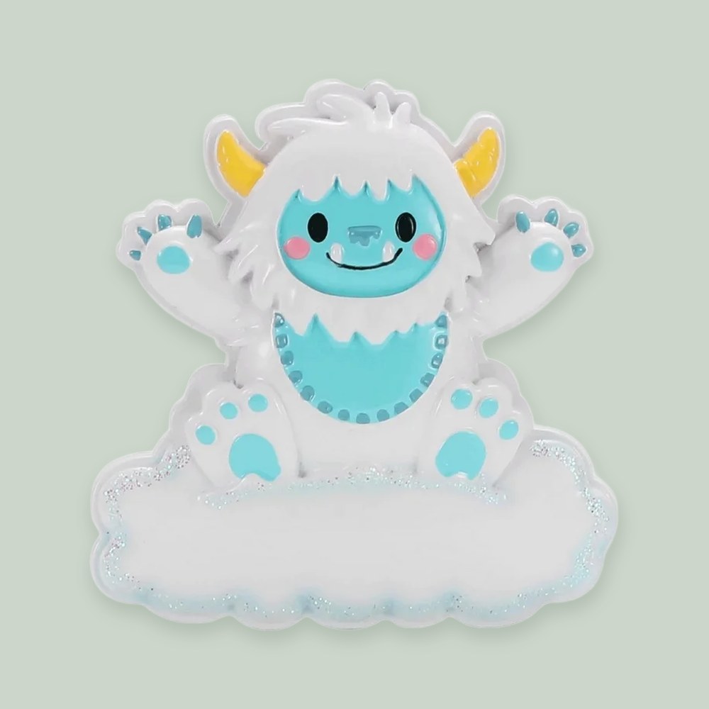 Baby Yeti (Blue) ornament on a sage green background