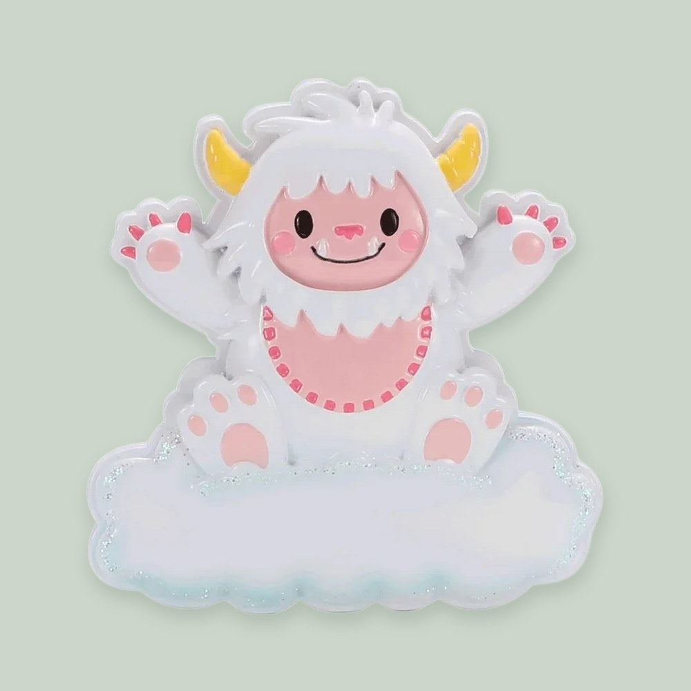 Baby Yeti (Pink) ornament on a sage green background