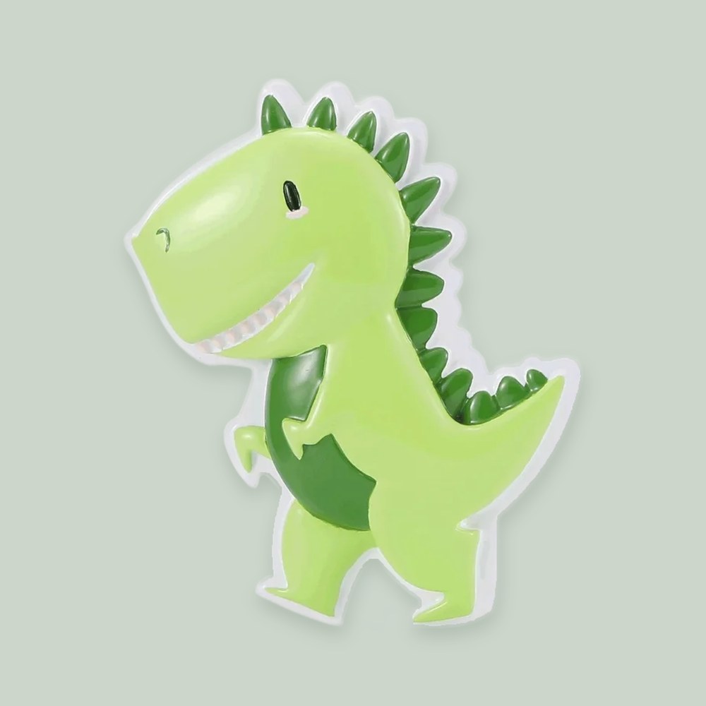 Cutesy Green Dino ornament on a sage green background