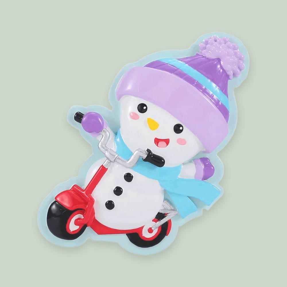 Snowman on Scooter ornament on a sage green background