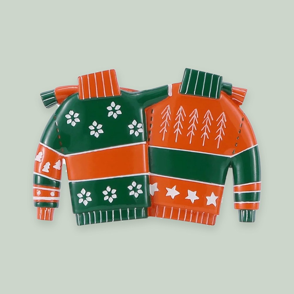 Christmas Sweater Couple ornament on a sage green background