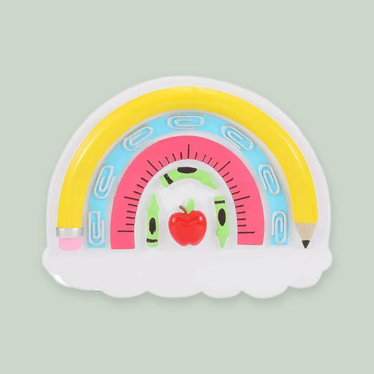 Teacher Rainbow with School Supplies ornament on a sage green background