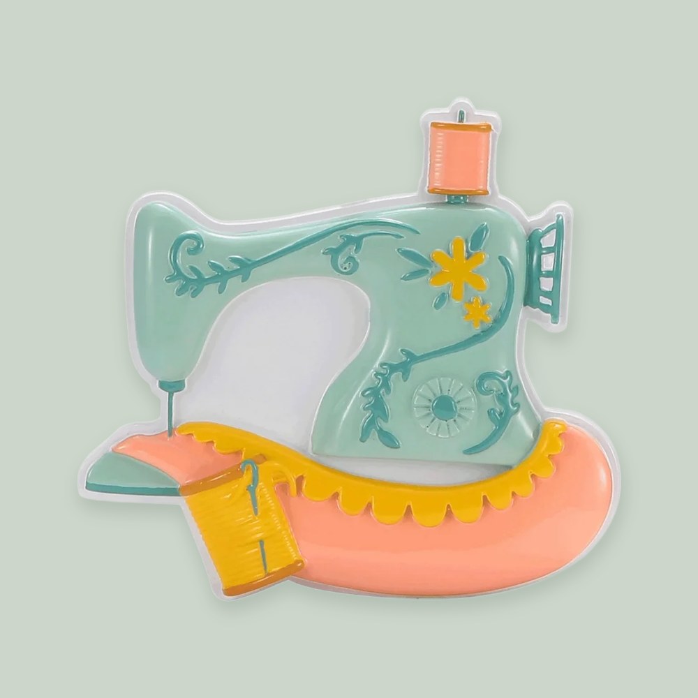 Vintage Sewing Machine ornament on a sage green background