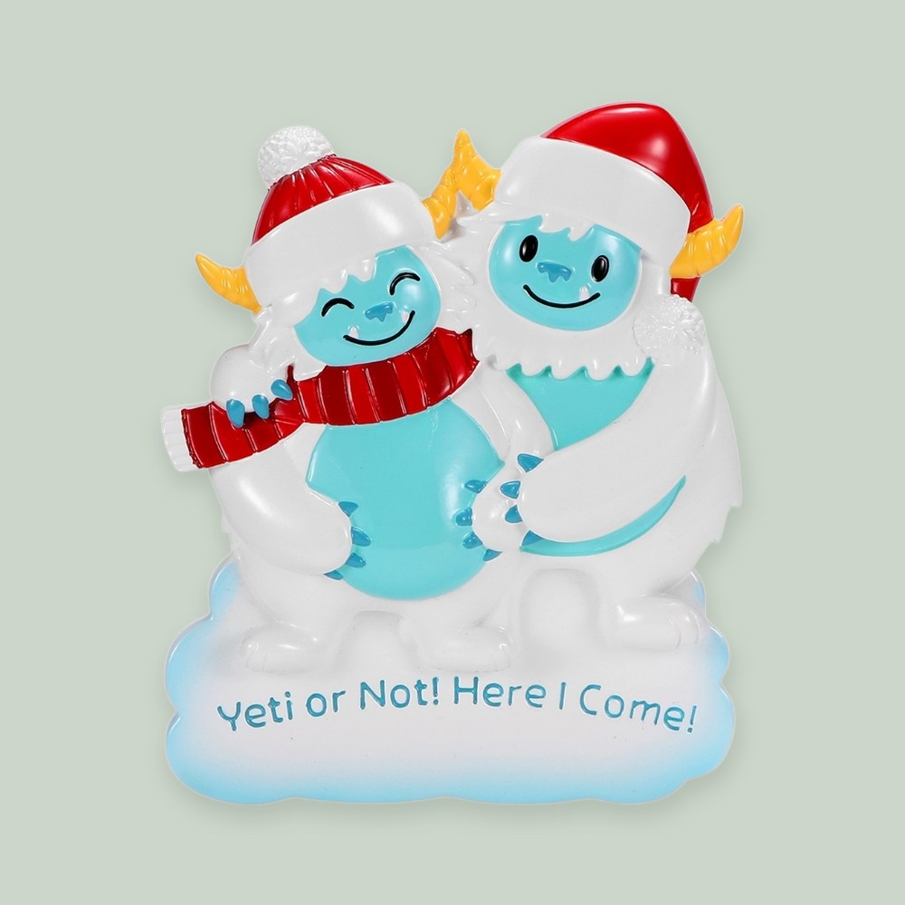 We're Expecting Yeti Couple ornament on a sage green background