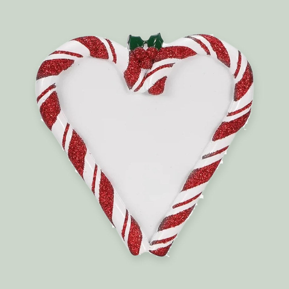 Candy Cane Heart ornament on a sage green background