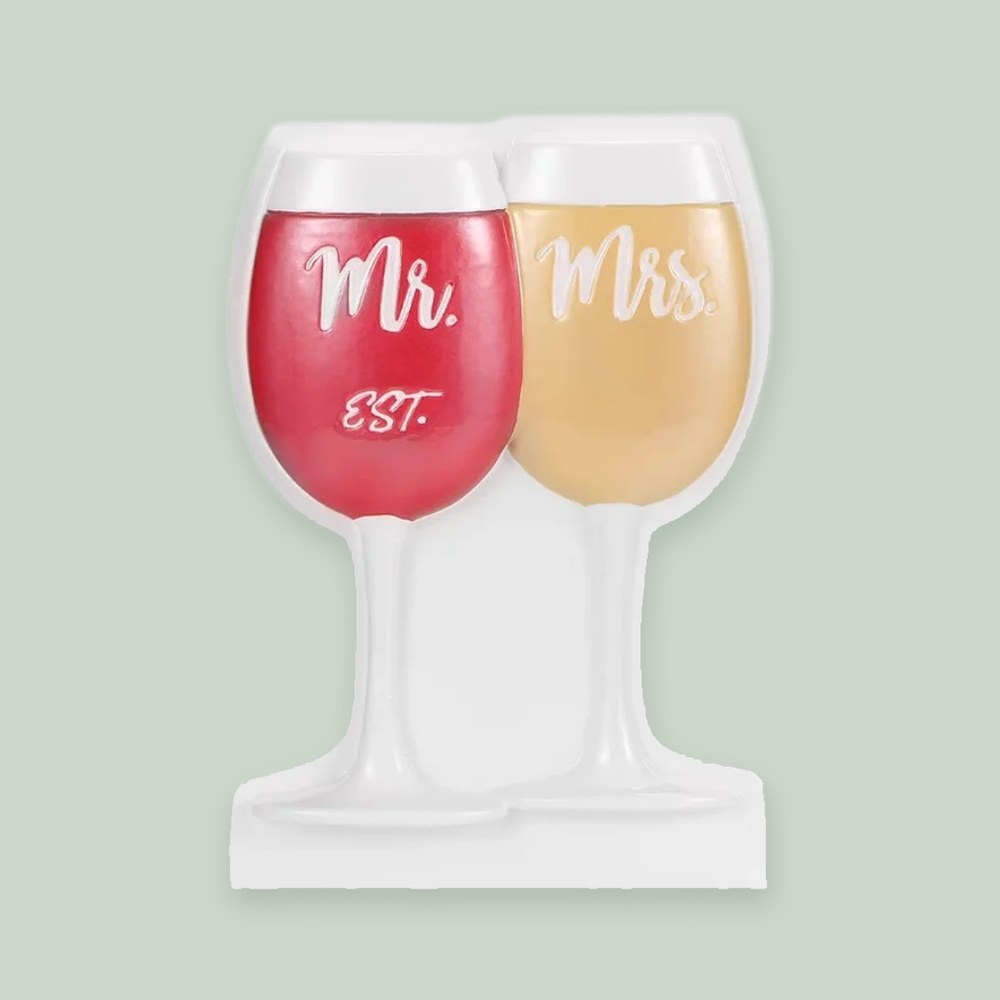 Mr. and Mrs. Wine Glasses ornament on a sage green background