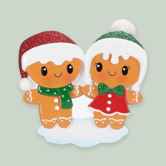 Gingerbread Couple ornament on a sage green background
