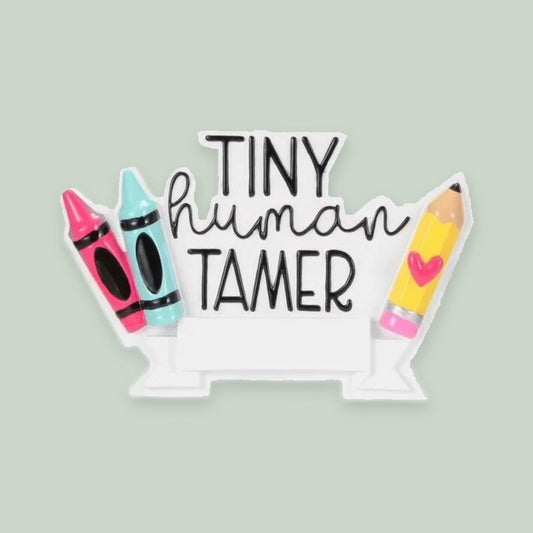 Day Care “Tiny Human Trainer” ornament on a sage green background