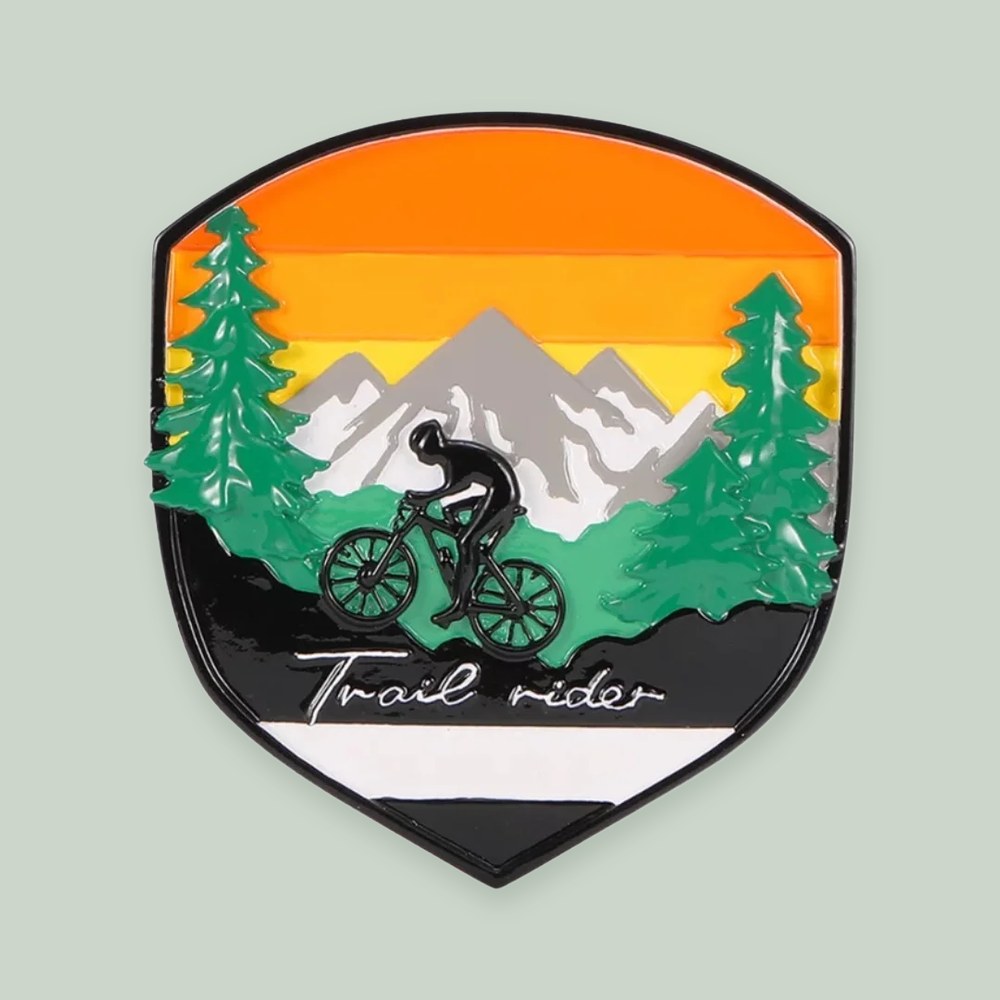 Adventure Badge Mountain Biking ornament on a sage green background