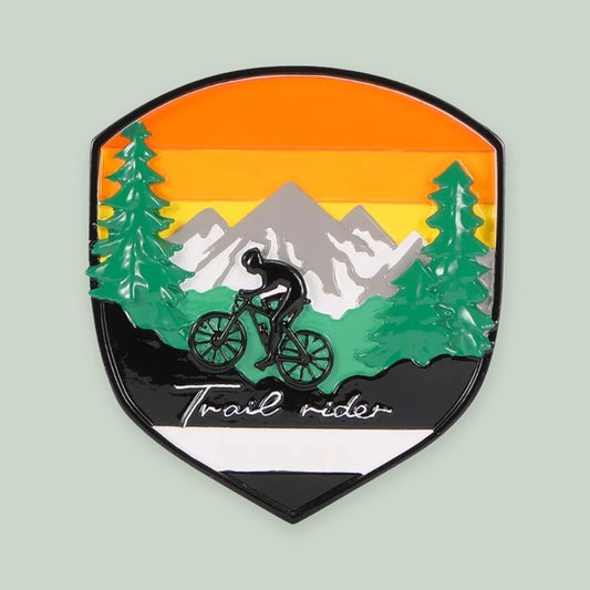 Adventure Badge Mountain Biking ornament on a sage green background