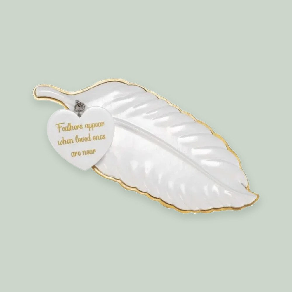 Angel Feather”Feathers Appear When Loved Ones Are Near” ornament on a sage green background