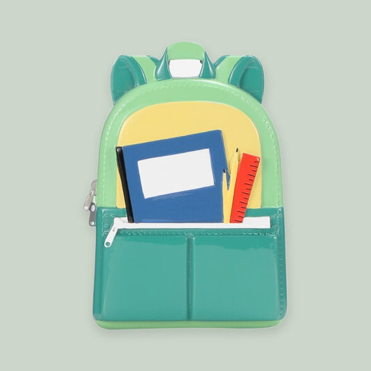 Green Backpack ornament on a sage green background
