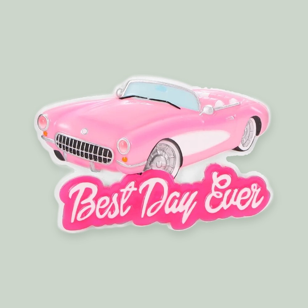 Pink Doll Convertible ornament on a sage green background