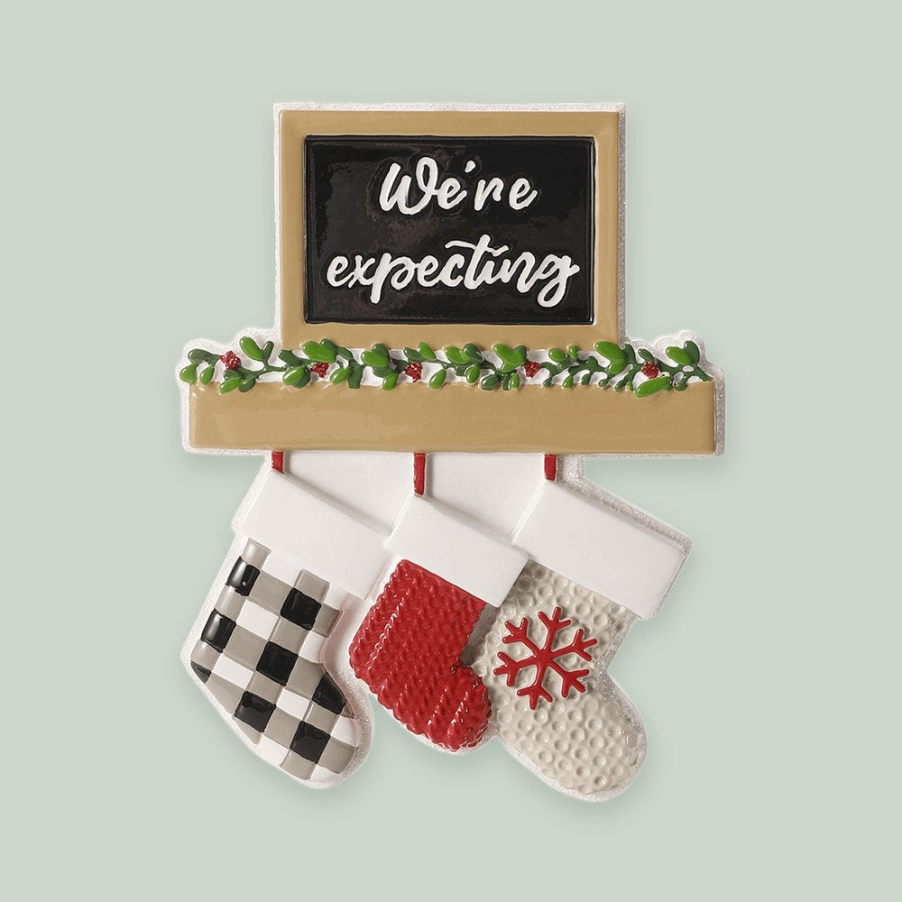 Fireplace Mantel — We're Expecting ornament on a sage green background