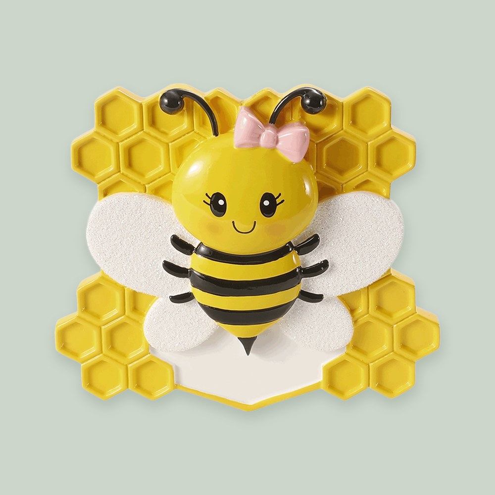 Baby Bee with Bow ornament on a sage green background