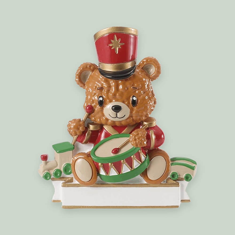 Bear with Drum & Train ornament on a sage green background