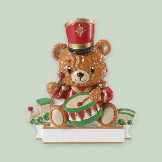 Bear with Drum & Train ornament on a sage green background