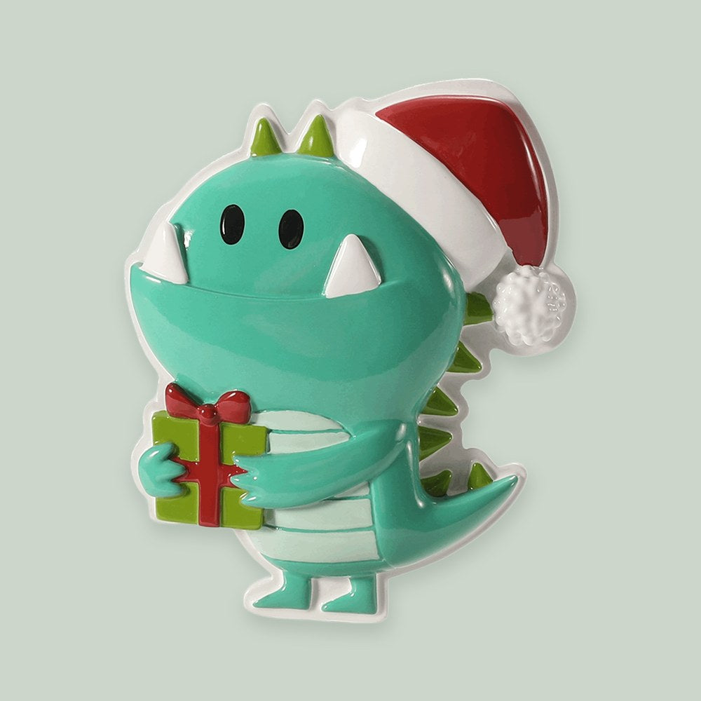 Green Christmas Monster ornament on a sage green background
